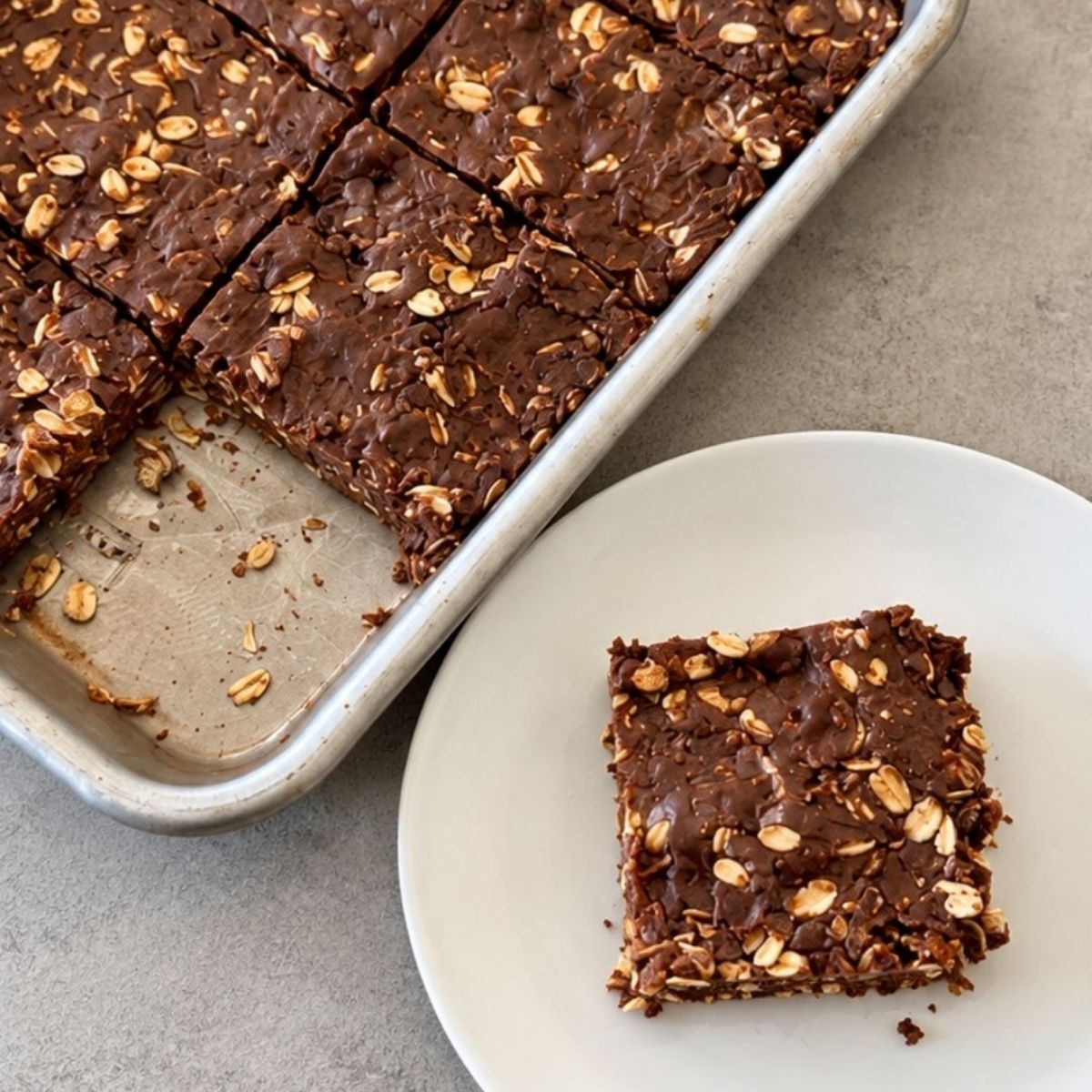 No-bake chocolate coconut oat bars made with peanut butter, oats, shredded coconut, and mini chocolate chips for an easy homemade snack.